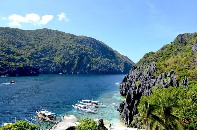 Aerial view of El Nido’s limestone cliffs and turquoise lagoons in Palawan, one of the most beautiful islands in the Philippines.