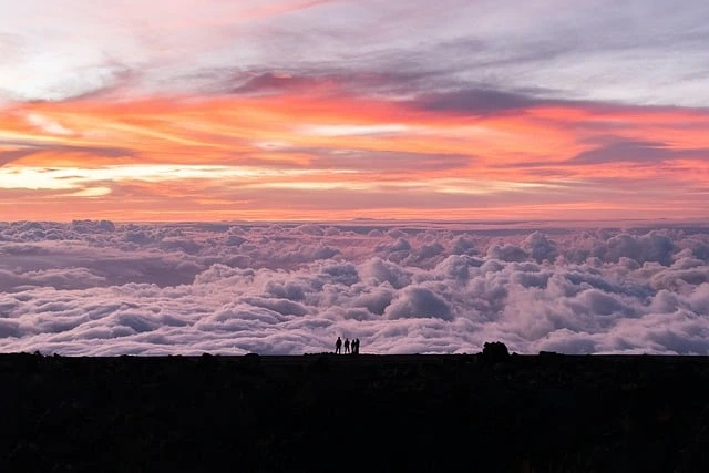 Scenic view of Maui, known as one of the most beautiful islands, featuring its black sand beach at Wai'anapanapa State Park with crystal-clear waters.