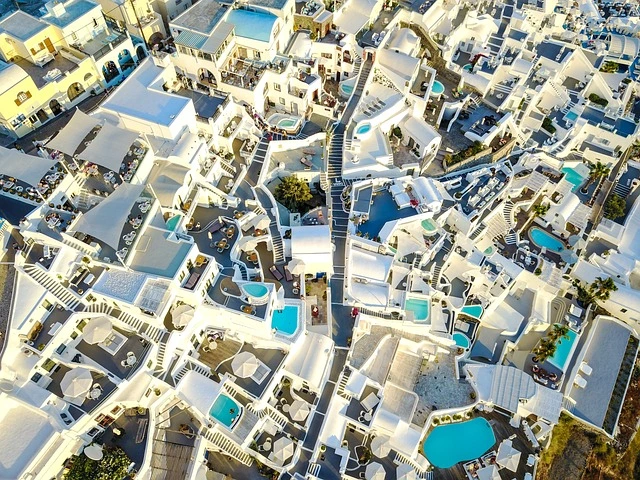 Stunning sunset over Santorini, one of the most beautiful islands, with its iconic whitewashed buildings and blue domes overlooking the Aegean Sea