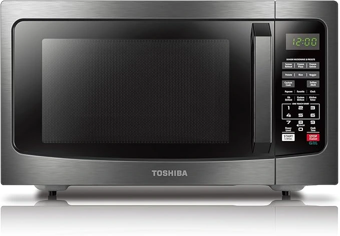 TOSHIBA EM131A5C-BS good oven featuring a 1.2 Cu Ft capacity, 12.4-inch removable turntable, smart humidity sensor, and 12 auto menus. A sleek black countertop good oven for modern kitchens.